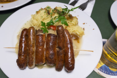 Three types of roasted sausages
