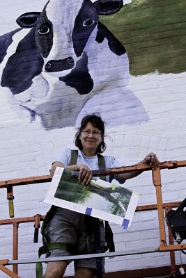 Cuba, NY--Cheese Shop Muralist on Scaffold Lift