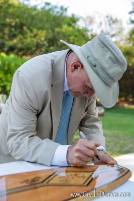 Couple brought custom surf board for guests to sign. Photo by Cecilia Dumas Associates Freddie