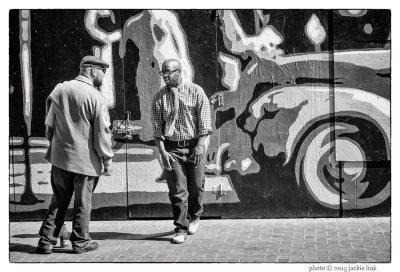 02 Two Men Talking on Market Street