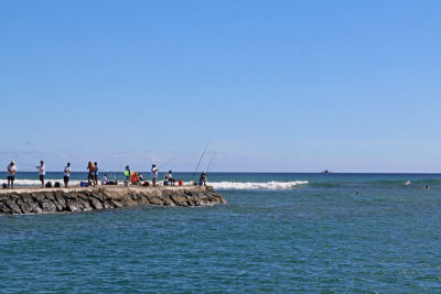 Fishermen at channel entrance