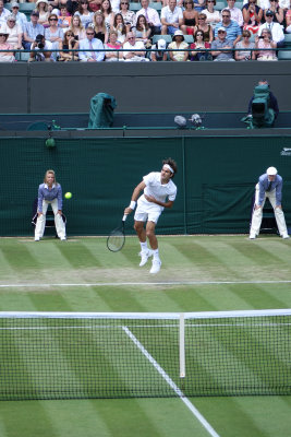 Federer serves