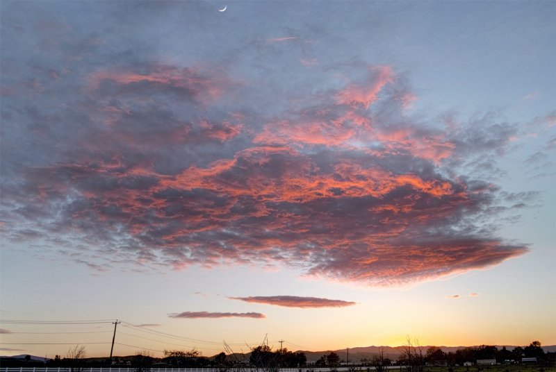 Cresent Moon over Red Clouds