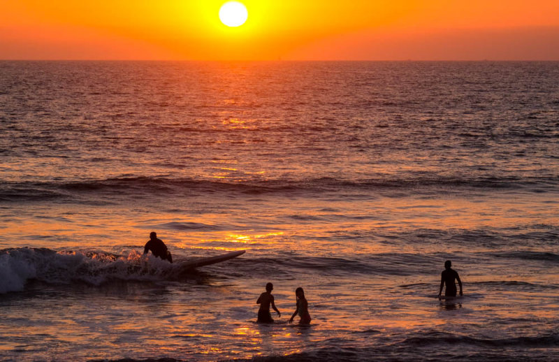 Surfers at sunset, Imperial Beach, California, 2014
