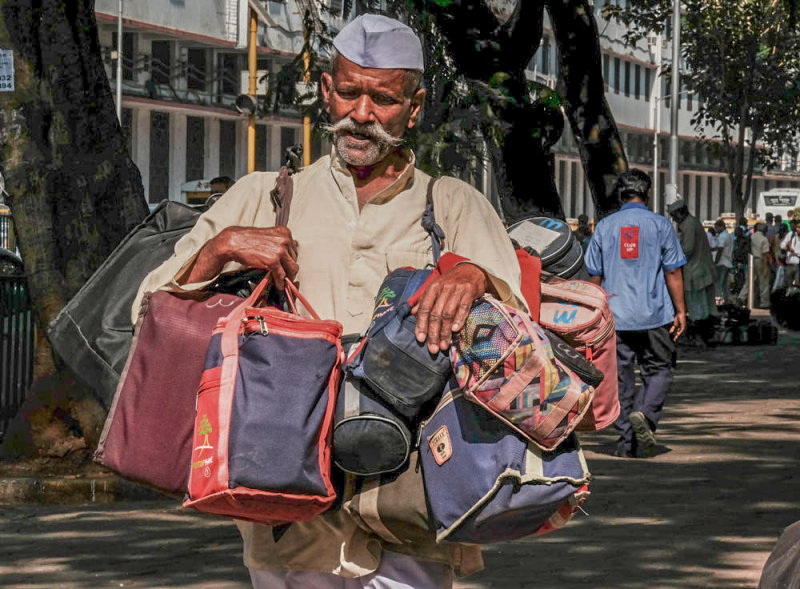 A Dabbawala brings the lunch, Bombay, India, 2016