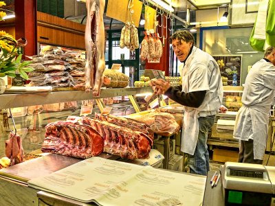 The butcher has just started preparing his Fiorentina steaks