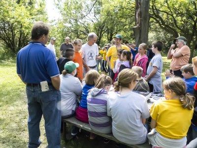 Young folks from Clear-Creek Amana watching the banding.
Rob Bradley [light tee] is talking.