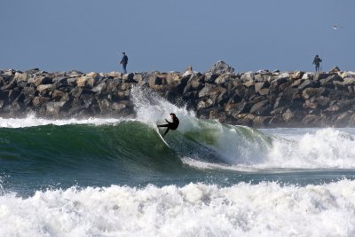 Surfer at the month of the San Diego River