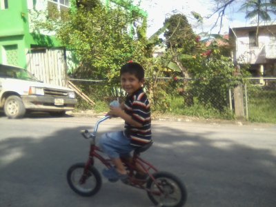 Jian on his bike and di slide 02.jpg