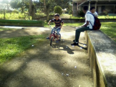 Jian on his bike and di slide 08.jpg