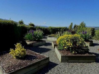 RainbowLakeHouseGardenNZ2016.JPG