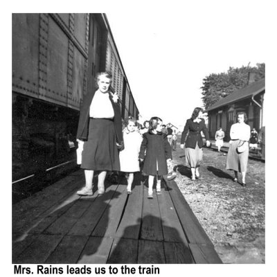 Mrs. Rains leads us to the boarding steps.
