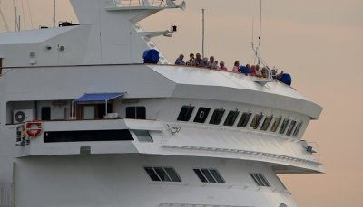 A bunch of passengers on the bridge.