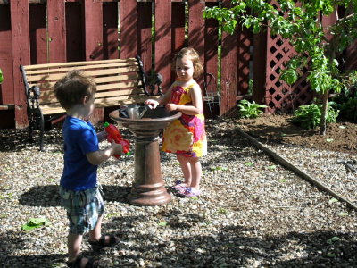 Alex and Natalie play in our back yard.JPG