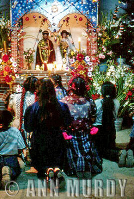 Women praying at the altar