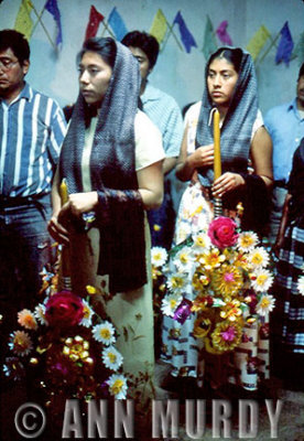 Young Women holding velas