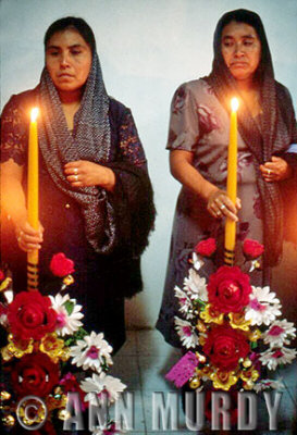  Two Ladies holding velas