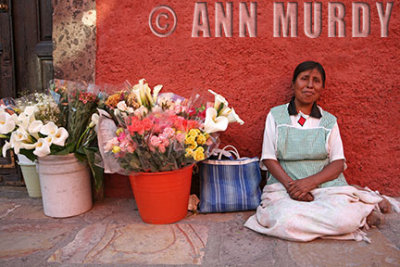 Lady selling calla lilies