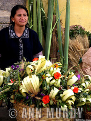 Lady with basket of palm weavings