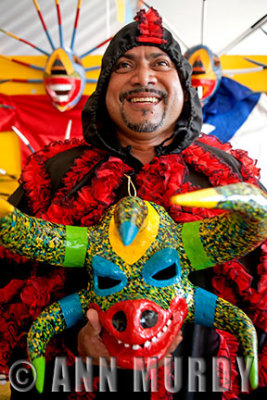 Jamie Zayas of Puerto Rico holding mask by Raul Ayala Carrasquillo