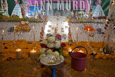 The bottom tier of Ana María's altar