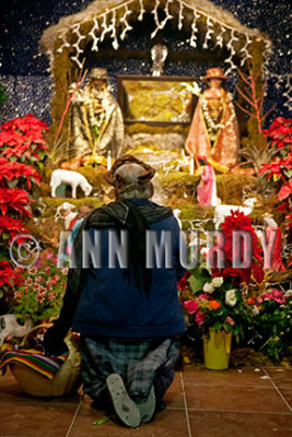 Praying at the posada altar