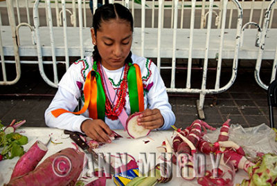 Little girl working on her radish carvings