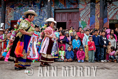 Dancing in front of the tiled mural