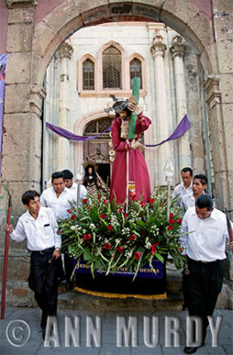 Carrying Cristo out of church courtyard
