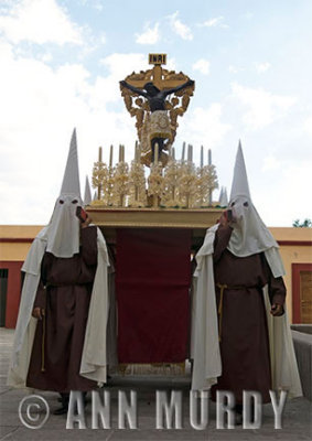 Penitentes carrying anda with Black Christ