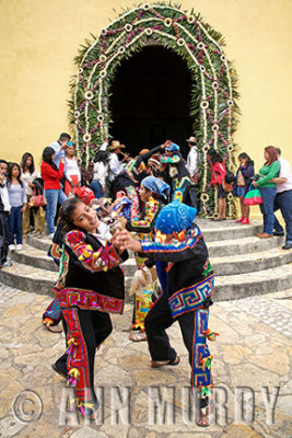 Tlacololero dancers outside capilla