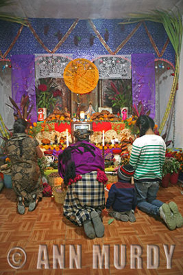 Praying at Juana's altar