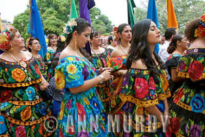 Checking cellphone in procession