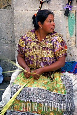 Lady weaving palms