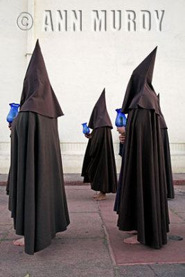 Penitentes carrying blue lanterns