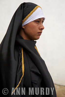 Girl in black in procession