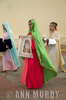 Three girls in procession