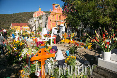 Decorating the graves at Santa María