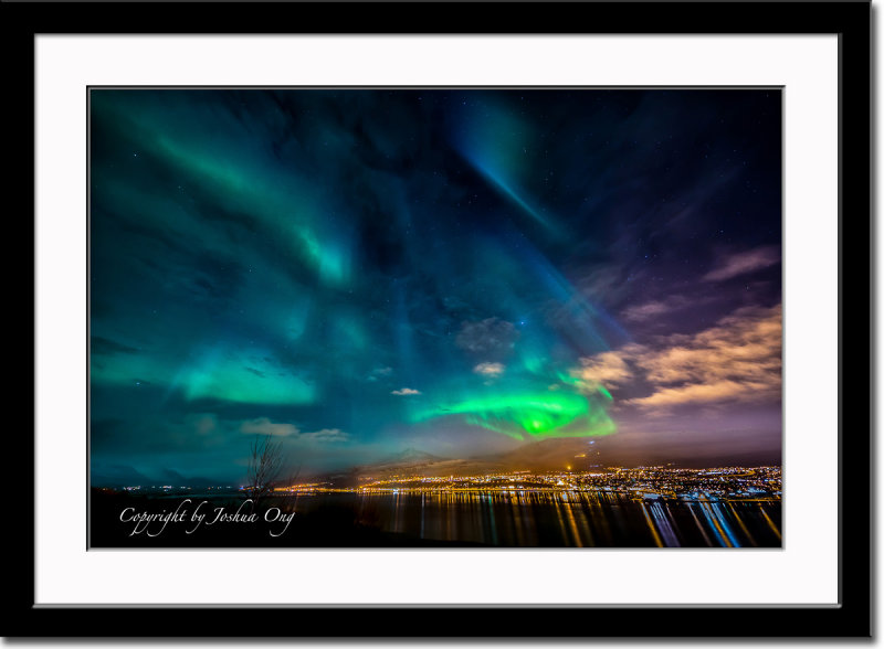 Aurora borealis and the city light of Akureyri