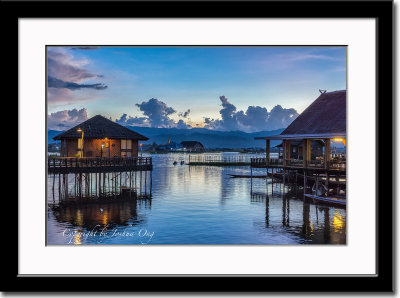 Floating cottage complex at dusk