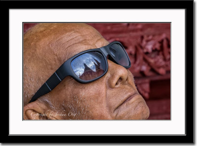 Shwedagon temple in this sunglasses' reflection