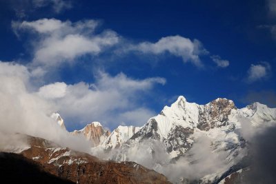 Clouds rose around the Annapurna IV peak