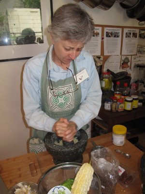 Liz working the mortar and pestle