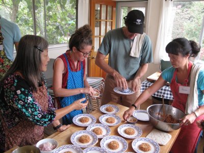 Kasma, Tracey, Bill, and Claudine plating rice salad