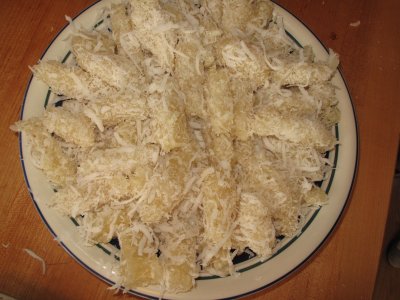 Steamed Cassava Strips Rolled in Shredded Coconut (Kanom Man)