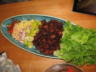 Northern Fried Soured Pork Ribs, Served with Diced Ginger and Shallots, Roasted Peanuts and Thai Chillies (Naem See Krohng)