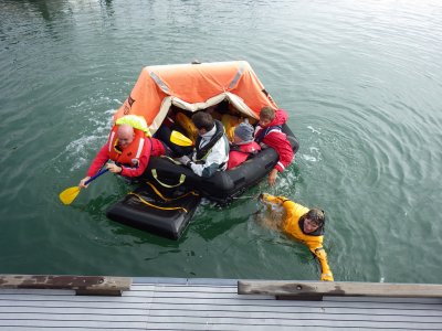 Paddling a liferaft is not easy, but they make it to safety. 2014_10_19_ISAF_Survival _089.jpg