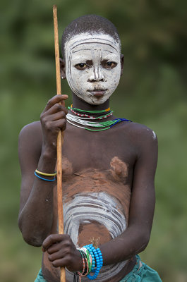 Young Surma with stick