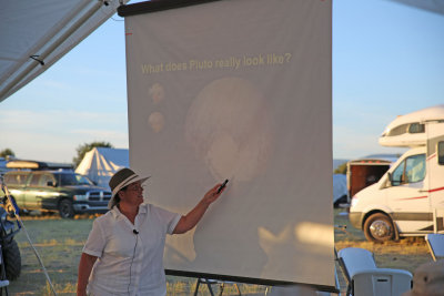 Gigi giving a presentation about Pluto