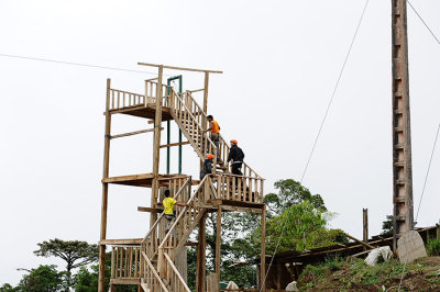 climb on the tower to slide through the forest .Mindo